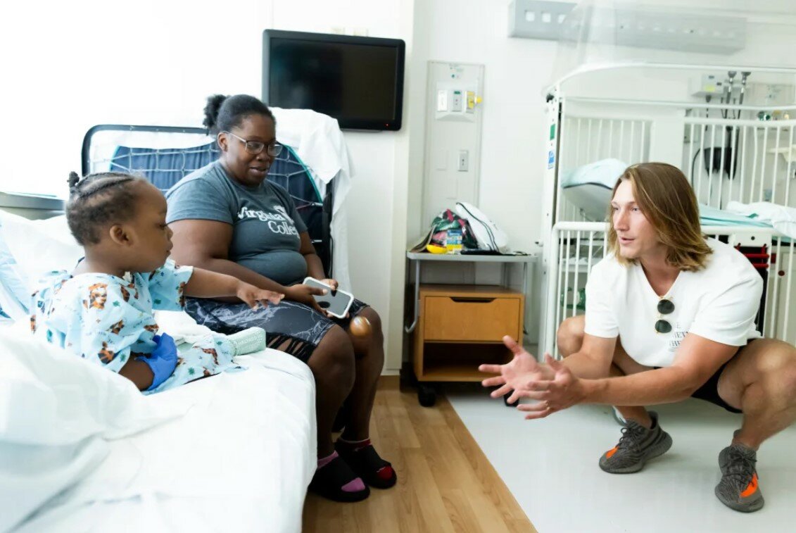 Trevor Lawerence interacts with a patient at Wolfson Children’s Hospital.